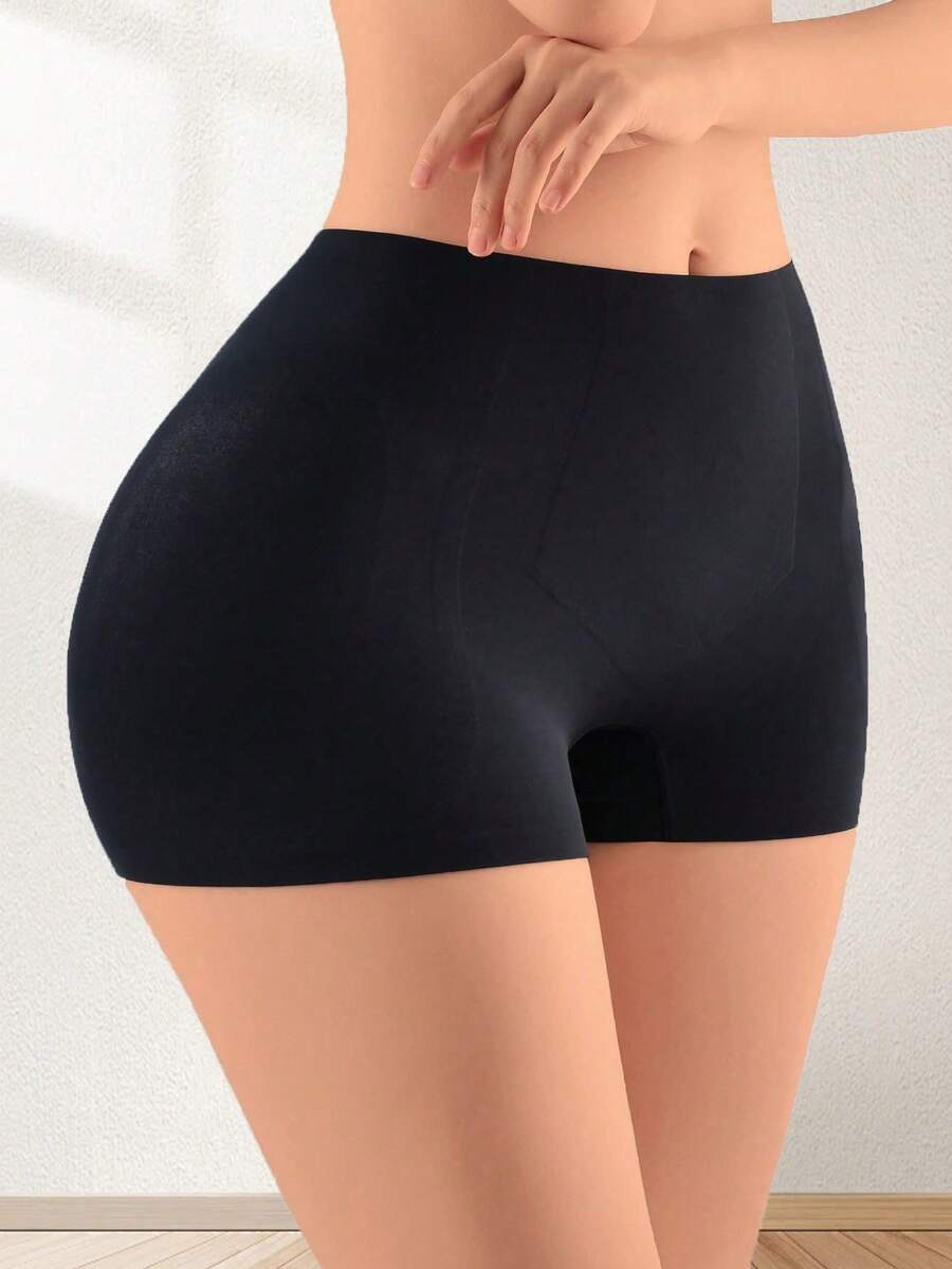 Women's high waist seamless tummy control panties with hip enhancer padding in apricot.