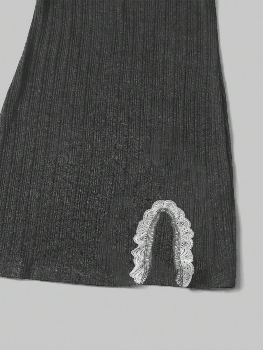 Women's black ribbed bodycon mini dress with scoop neck, short sleeves, contrast lace trim, and side split hem.