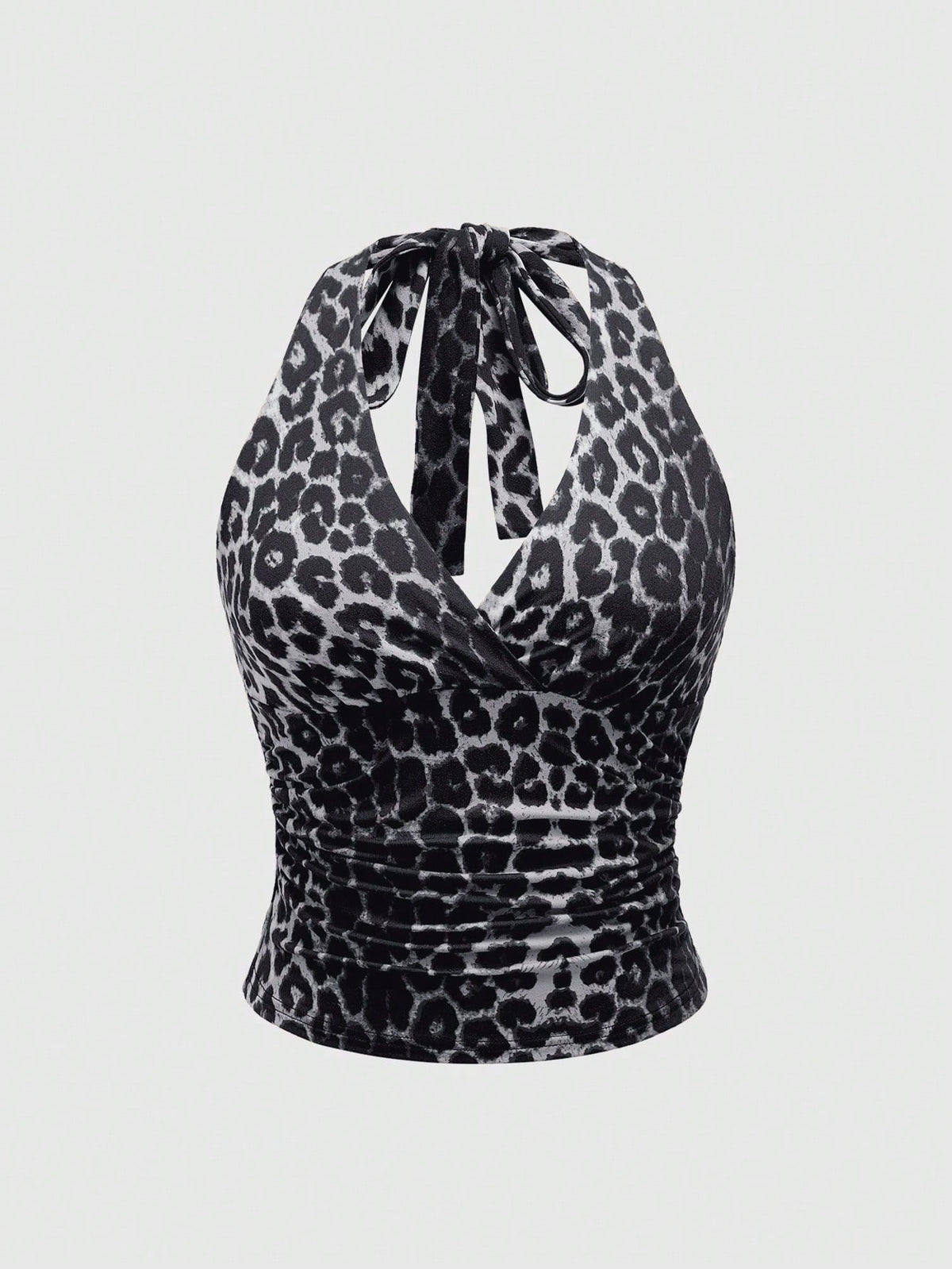 Women's halter crop tank top featuring a backless silhouette and ruched detailing in a slim fit design.