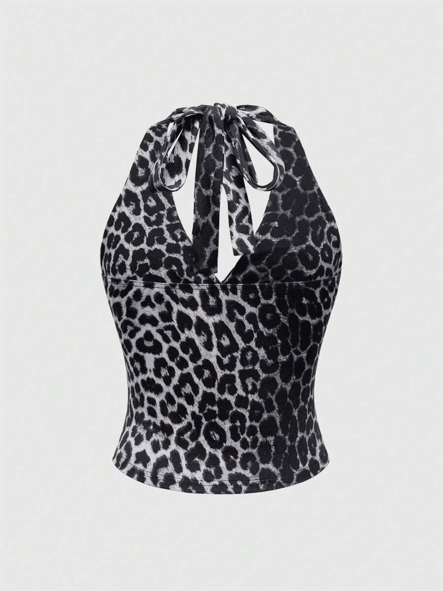 Women's halter crop tank top featuring a backless silhouette and ruched detailing in a slim fit design.