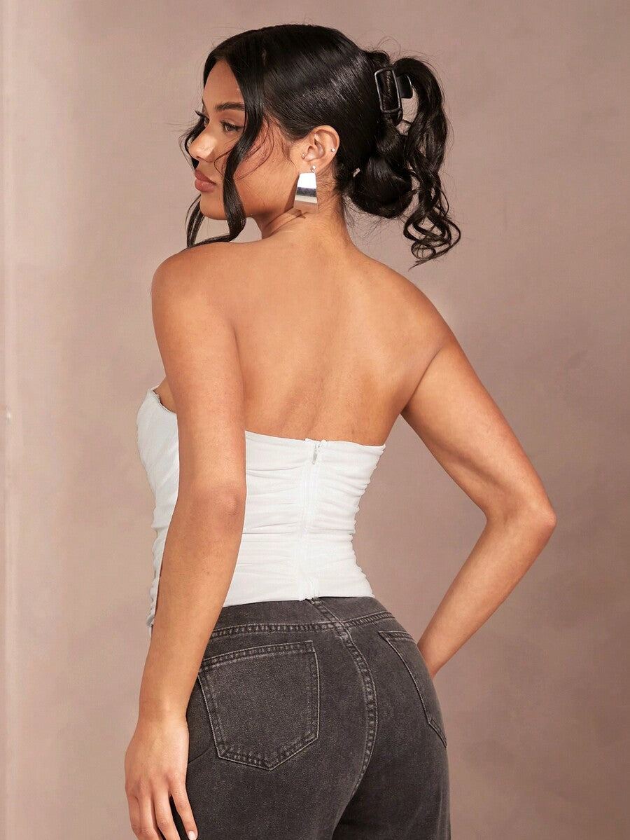 Black strapless corset crop top with asymmetrical lace-up ruched detailing and a slim fit for women.