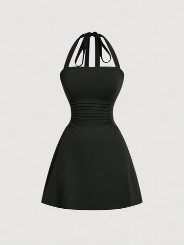 Women's black sleeveless halter neck A-line mini dress featuring backless ruched knot details and slim fit stretch knit fabric.