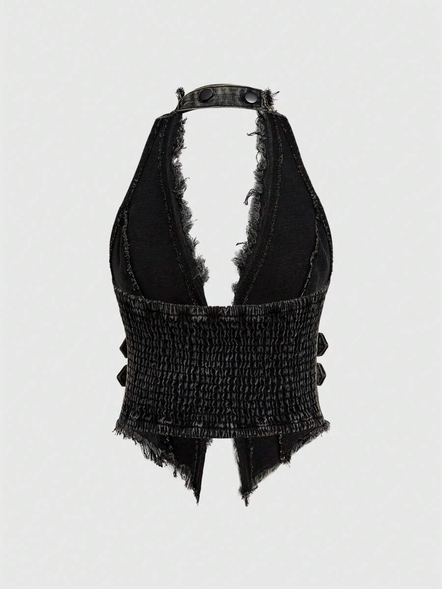 Women's denim halter crop top featuring a backless design, asymmetrical hem, single-breasted front, and lettuce trim.