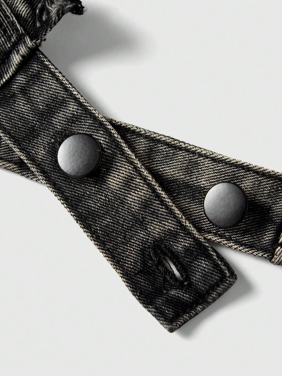 Women's denim halter crop top featuring a backless design, asymmetrical hem, single-breasted front, and lettuce trim.