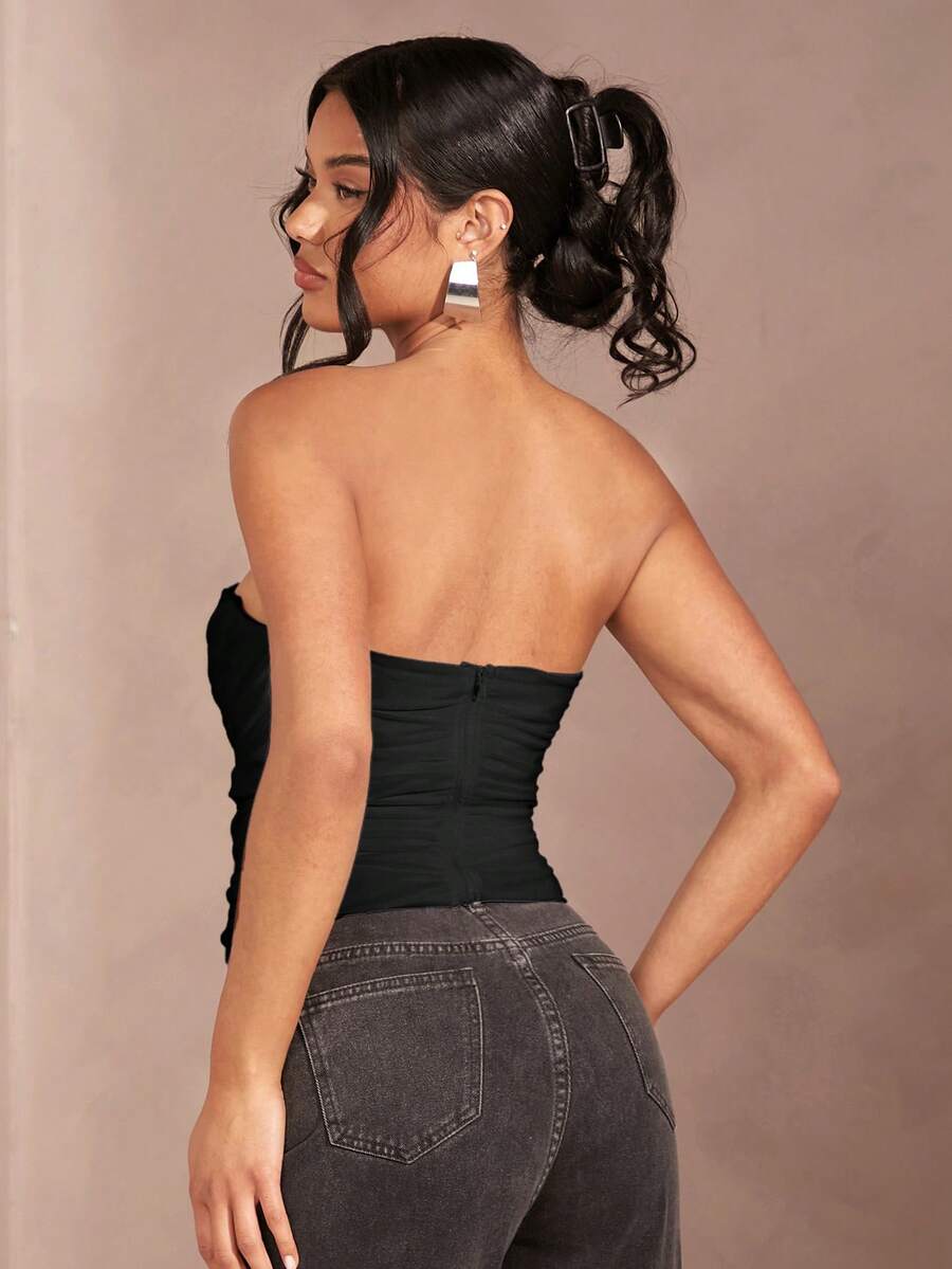 Black strapless corset crop top with asymmetrical lace-up ruched detailing and a slim fit for women.
