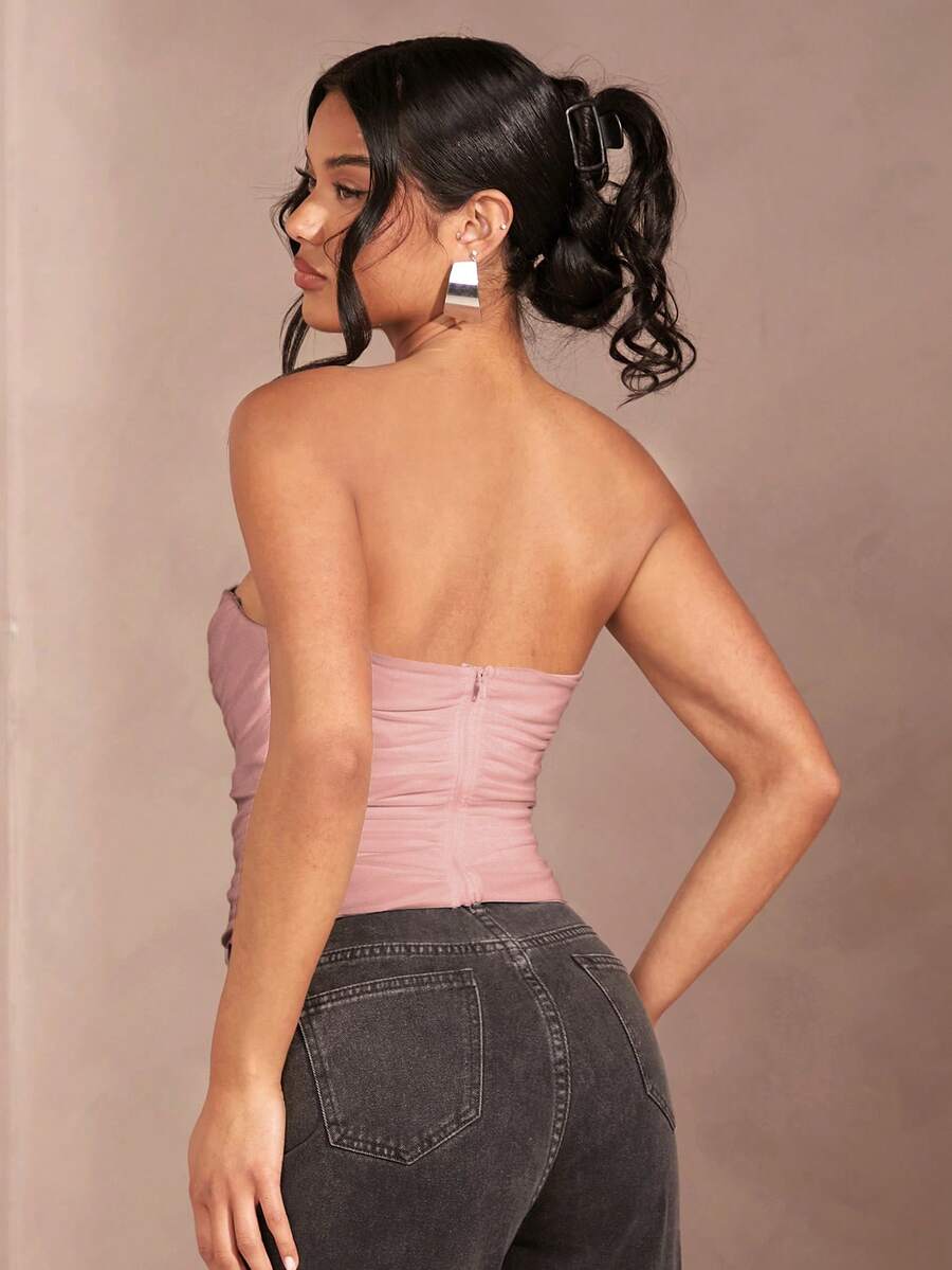 Black strapless corset crop top with asymmetrical lace-up ruched detailing and a slim fit for women.