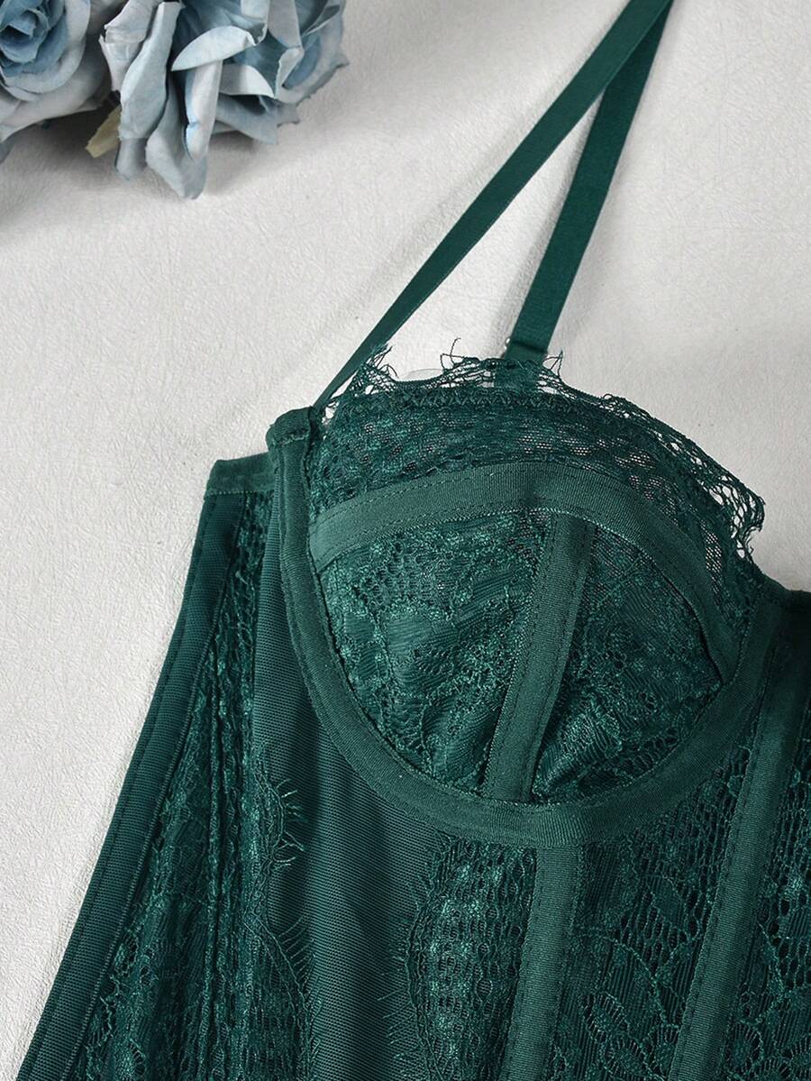 Black lace bustier corset top for women with asymmetrical contrast lace, lace-up detail, sleeveless crop cut, and light support.