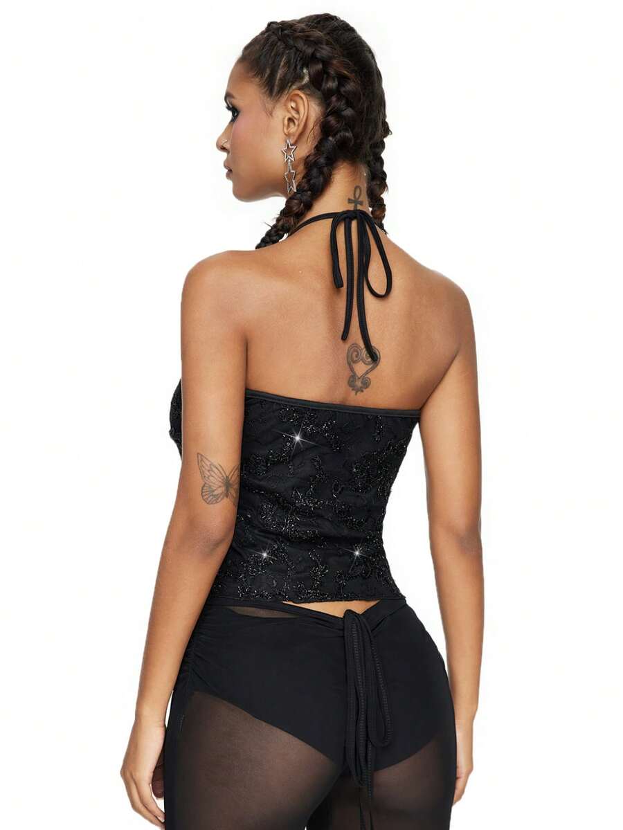Women's black mesh sequin halter top featuring a backless design, knot details, and lace fabric.