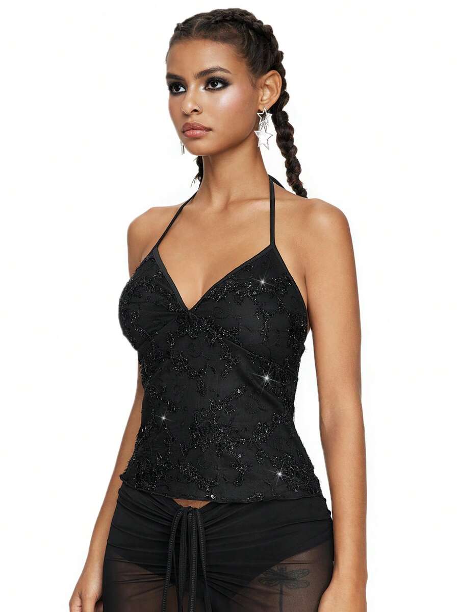 Women's black mesh sequin halter top featuring a backless design, knot details, and lace fabric.