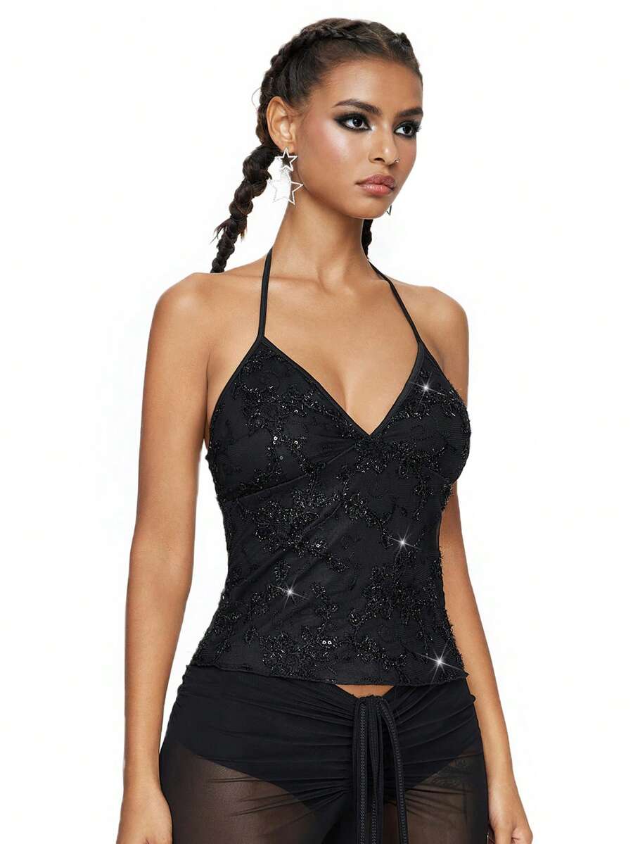 Women's black mesh sequin halter top featuring a backless design, knot details, and lace fabric.