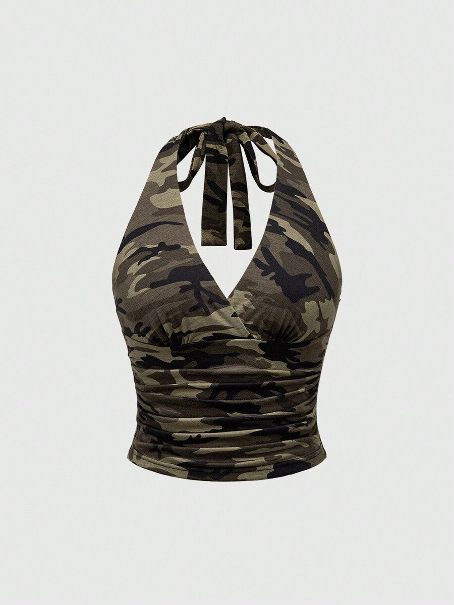 Women's halter crop tank top featuring a backless silhouette and ruched detailing in a slim fit design.