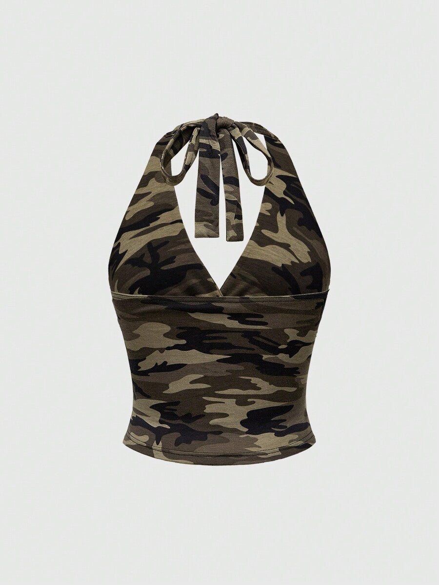 Women's halter crop tank top featuring a backless silhouette and ruched detailing in a slim fit design.