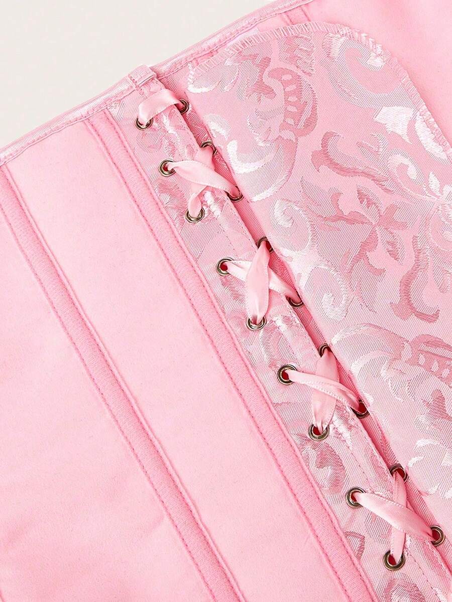 Vintage pink women's corset waist cincher with frill detail, designed for waist shaping and medium support.