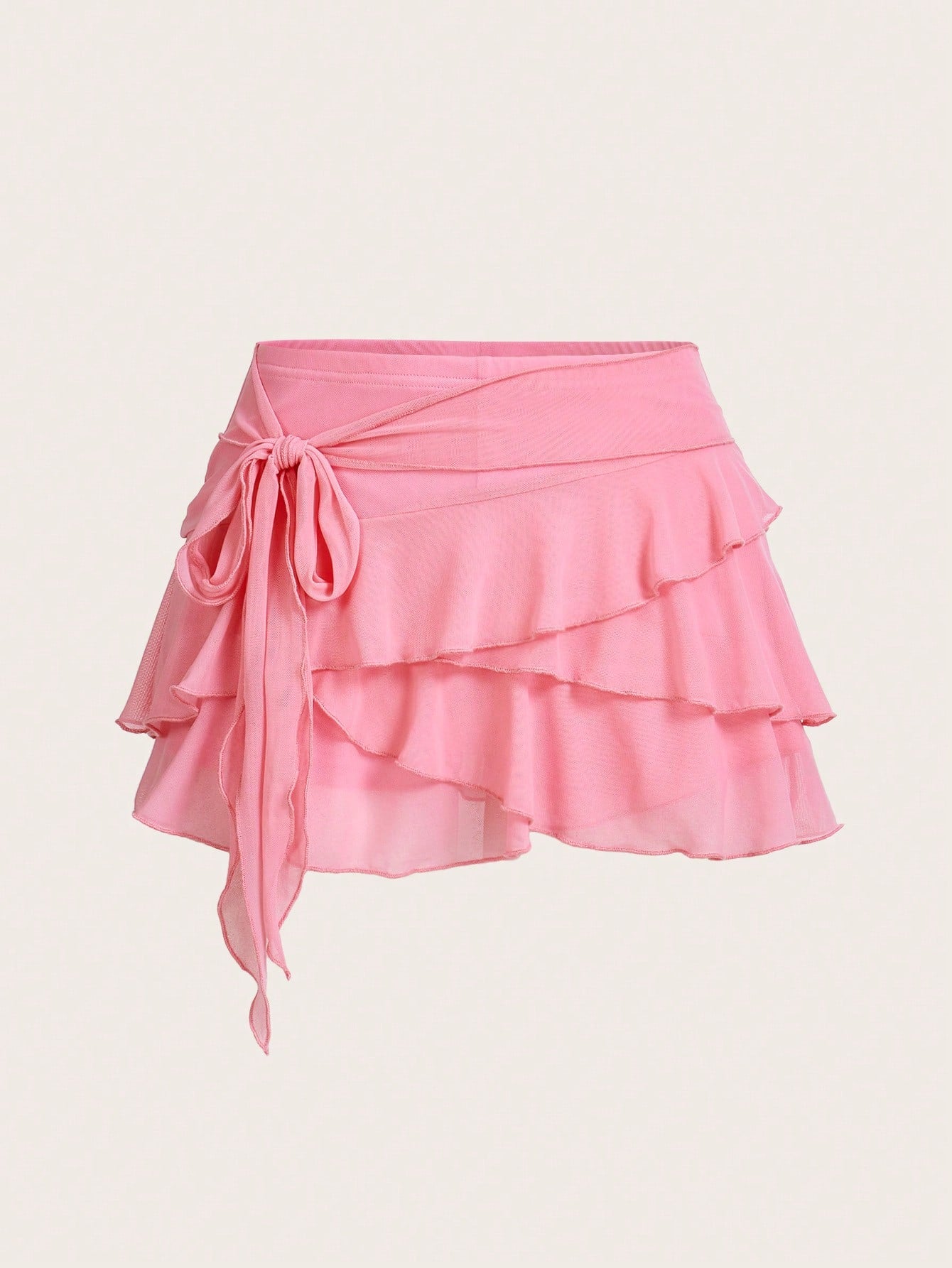 White tiered ruffle trim mini skirt for women with low waist, knot detail, mesh fabric, and casual Y2K boho design.