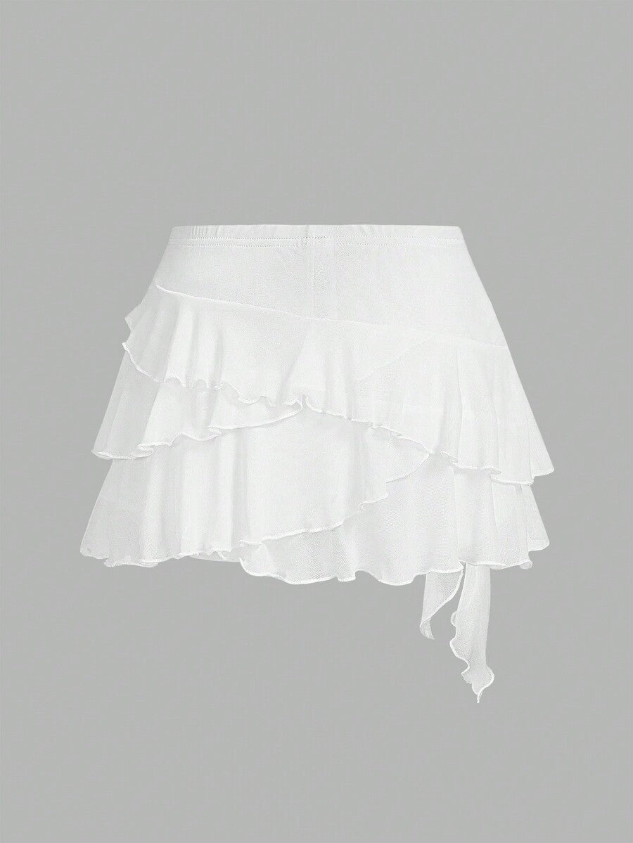 White tiered ruffle trim mini skirt for women with low waist, knot detail, mesh fabric, and casual Y2K boho design.