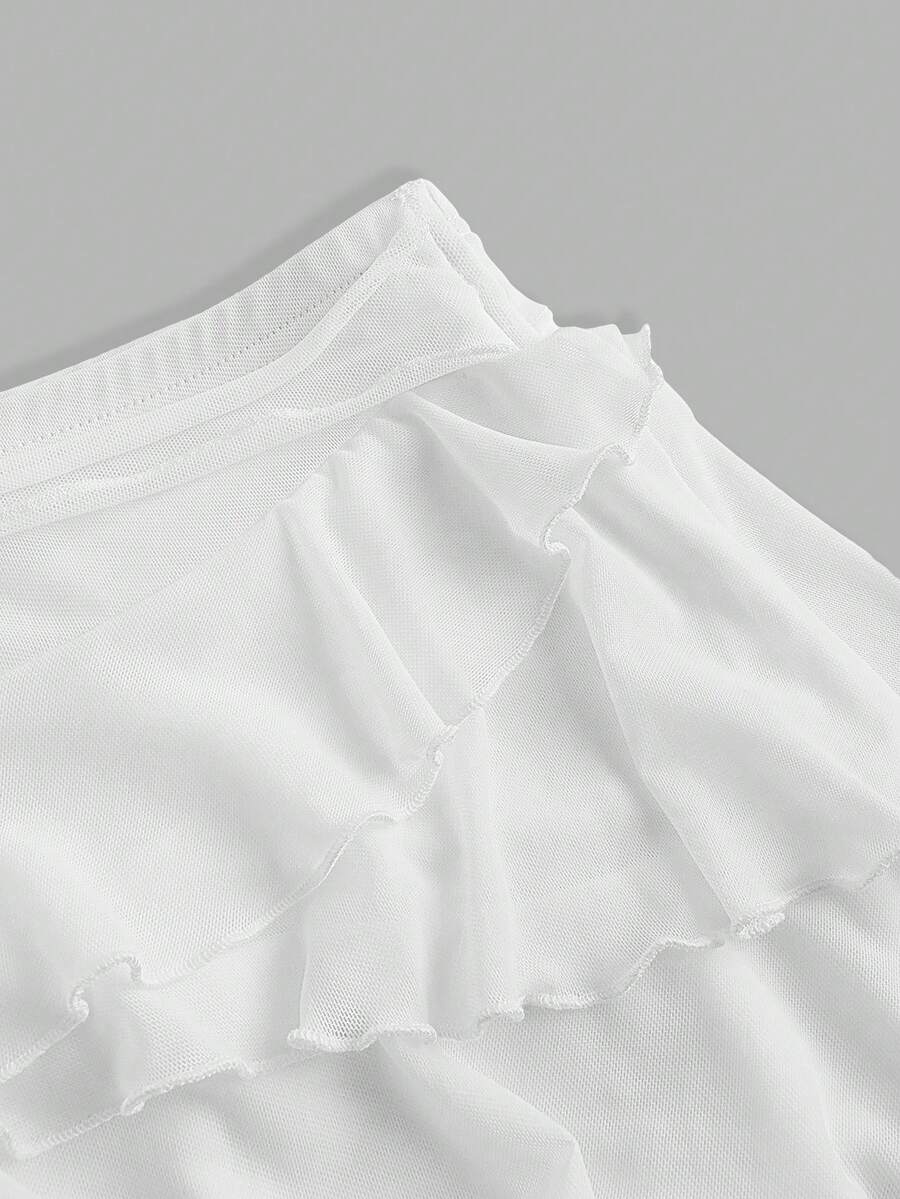 White tiered ruffle trim mini skirt for women with low waist, knot detail, mesh fabric, and casual Y2K boho design.