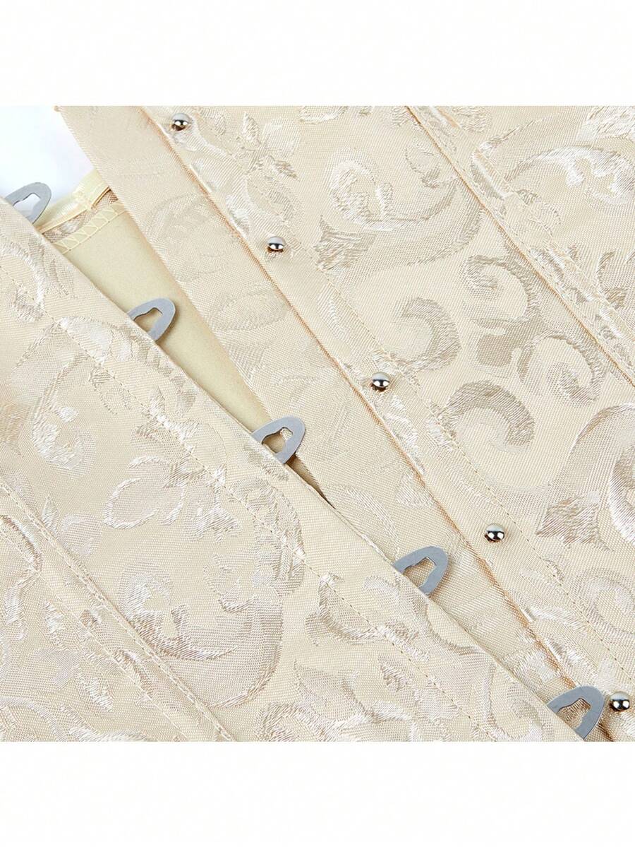 Vintage lace-up waist trainer corset with grommet eyelet details and plant pattern, designed for Halloween styling.