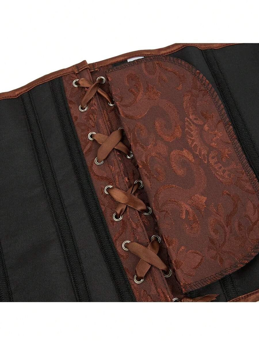 Vintage lace-up waist trainer corset with grommet eyelet details and plant pattern, designed for Halloween styling.