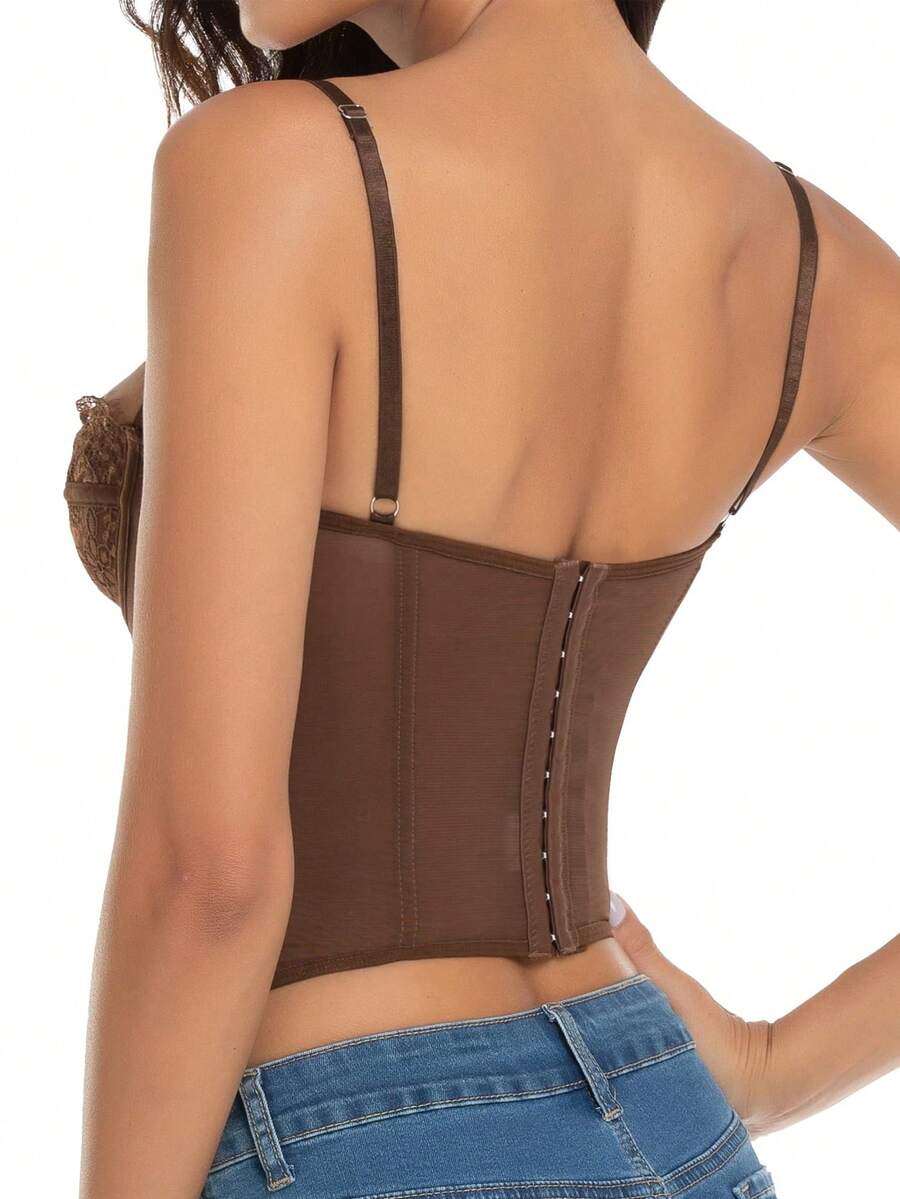 Black lace bustier corset top for women with asymmetrical contrast lace, lace-up detail, sleeveless crop cut, and light support.