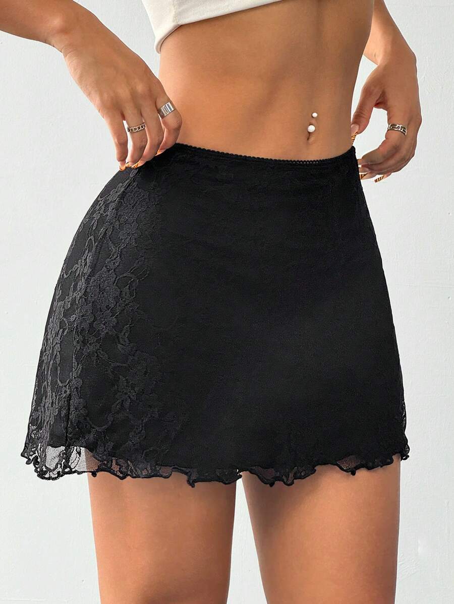 Women's black contrast lace mini skirt with low waist design, embroidery, and contrast mesh details.