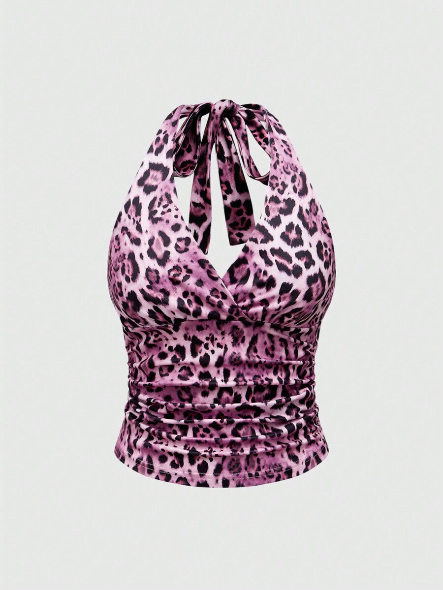Women's halter crop tank top featuring a backless silhouette and ruched detailing in a slim fit design.