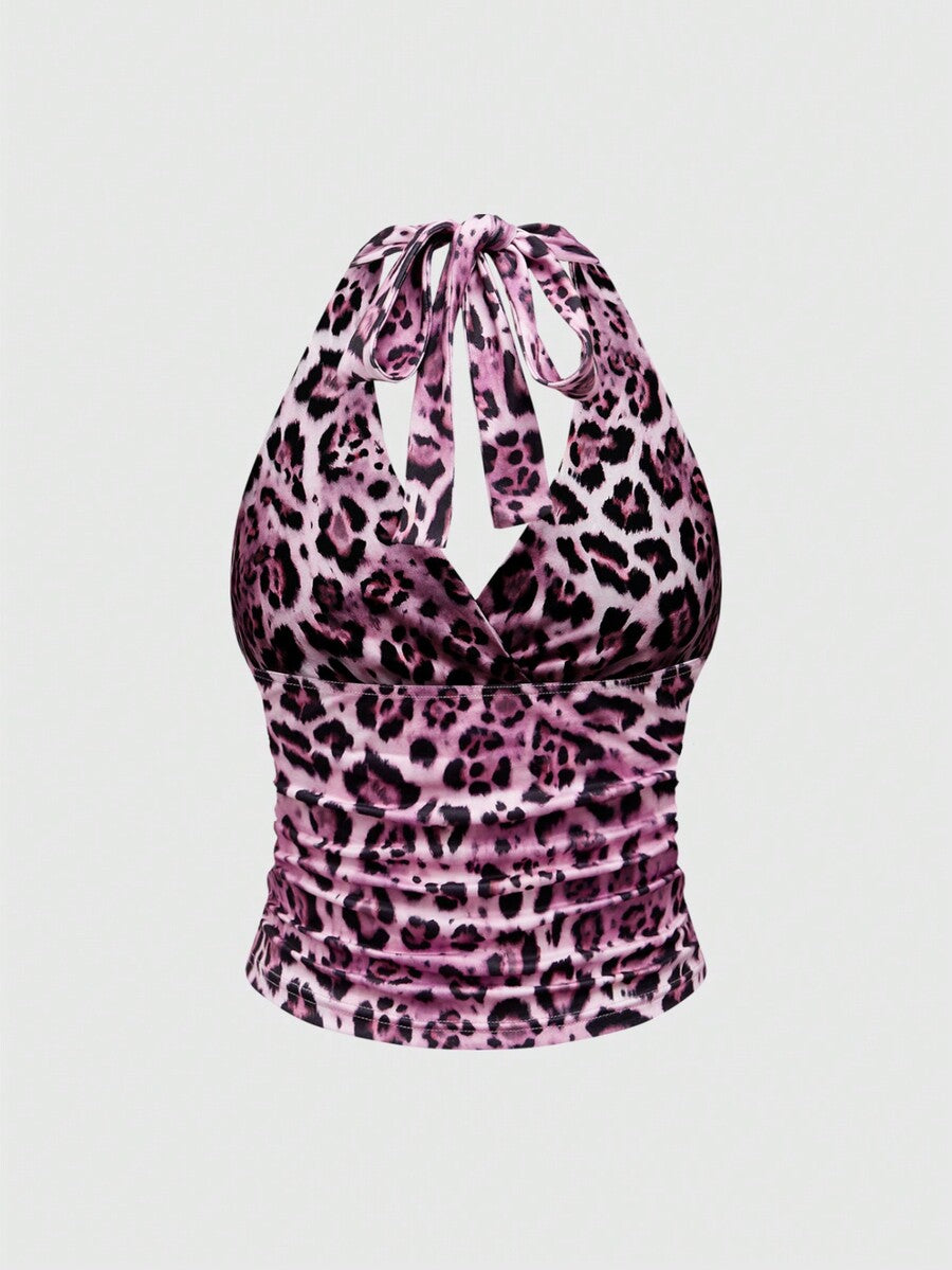 Women's halter crop tank top featuring a backless silhouette and ruched detailing in a slim fit design.