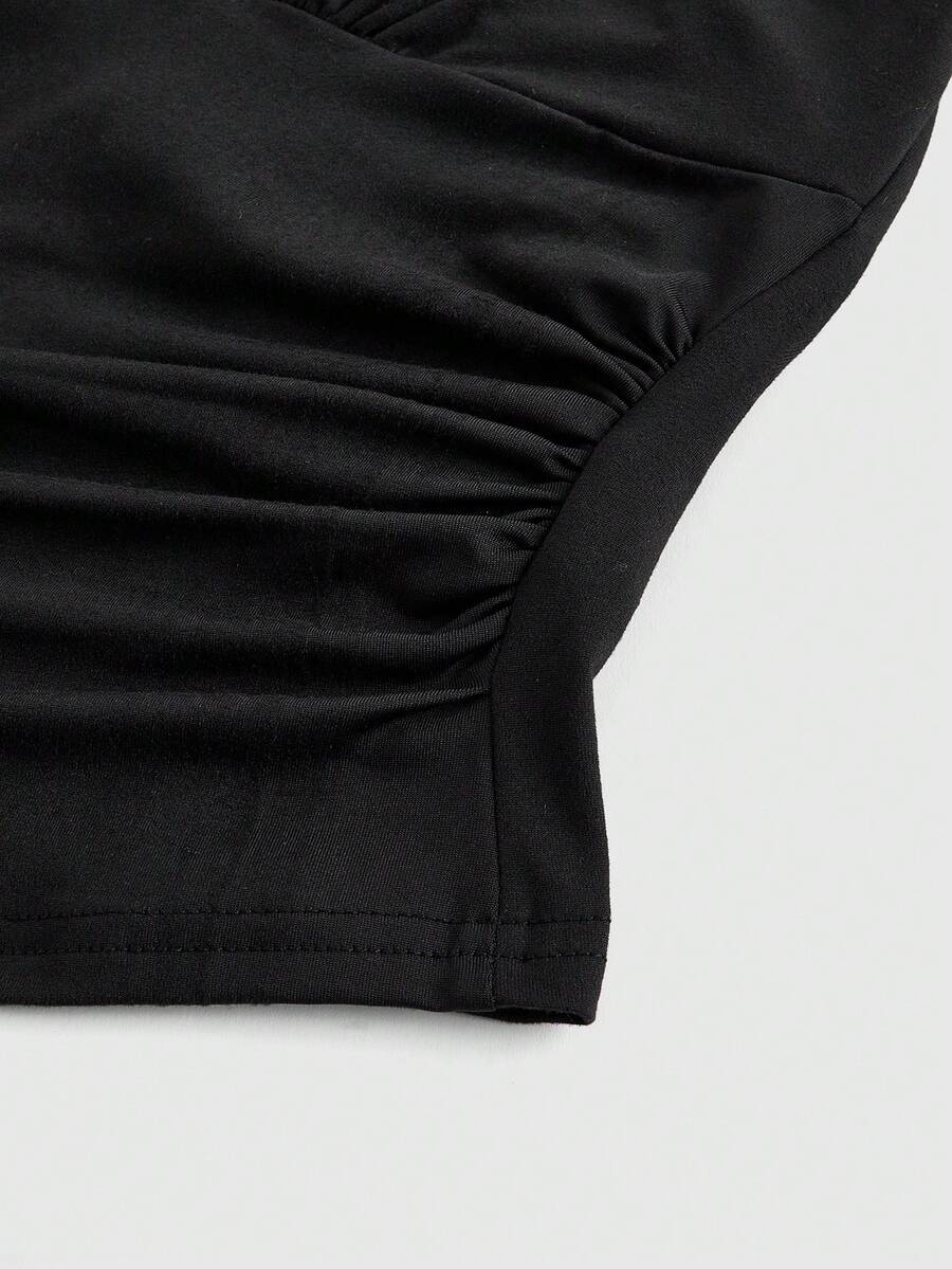 Women's halter crop tank top featuring a backless silhouette and ruched detailing in a slim fit design.