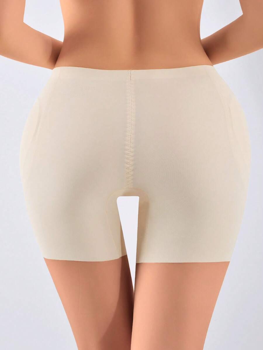 Women's apricot seamless padded shapewear panties featuring tummy control design and teardrop foam padding.