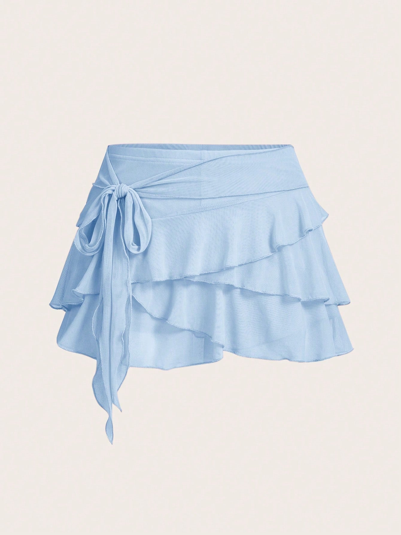 White tiered ruffle trim mini skirt for women with low waist, knot detail, mesh fabric, and casual Y2K boho design.