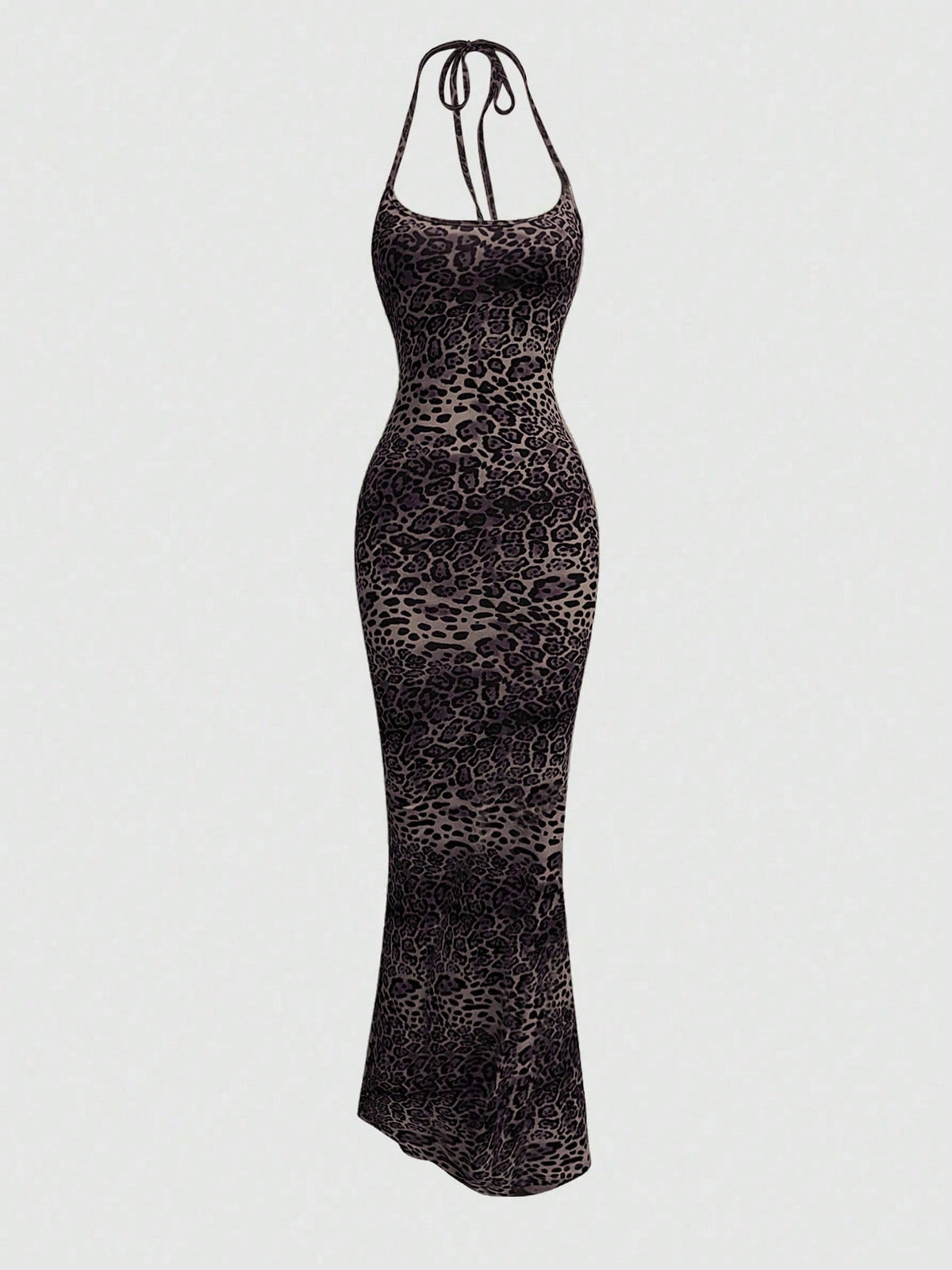 Women wearing a sleeveless leopard print halter neck maxi bodycon dress with a side slit