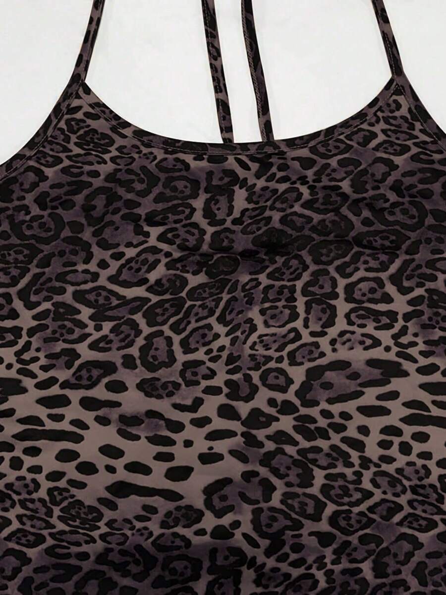 Women wearing a sleeveless leopard print halter neck maxi bodycon dress with a side slit