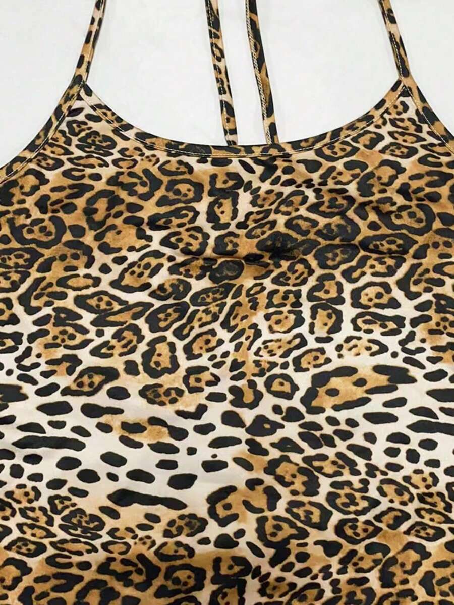 Women wearing a sleeveless leopard print halter neck maxi bodycon dress with a side slit
