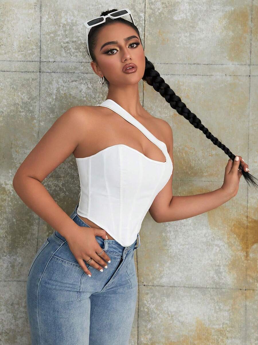 Women's black Y2K one-shoulder sleeveless backless crop top featuring an asymmetrical neckline and lace-up cutout design.