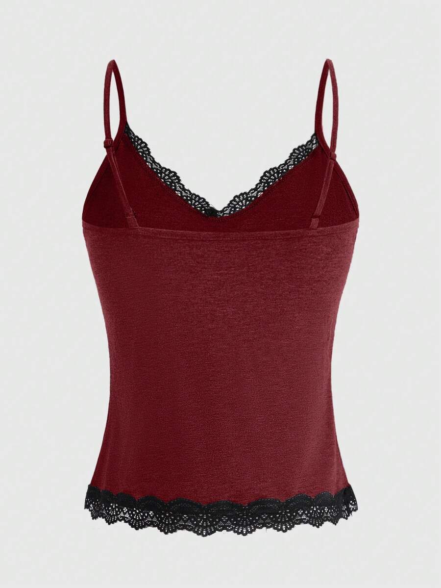 Pink floral print crop camisole top for women featuring contrast lace trim, spaghetti straps, and a slim fit.