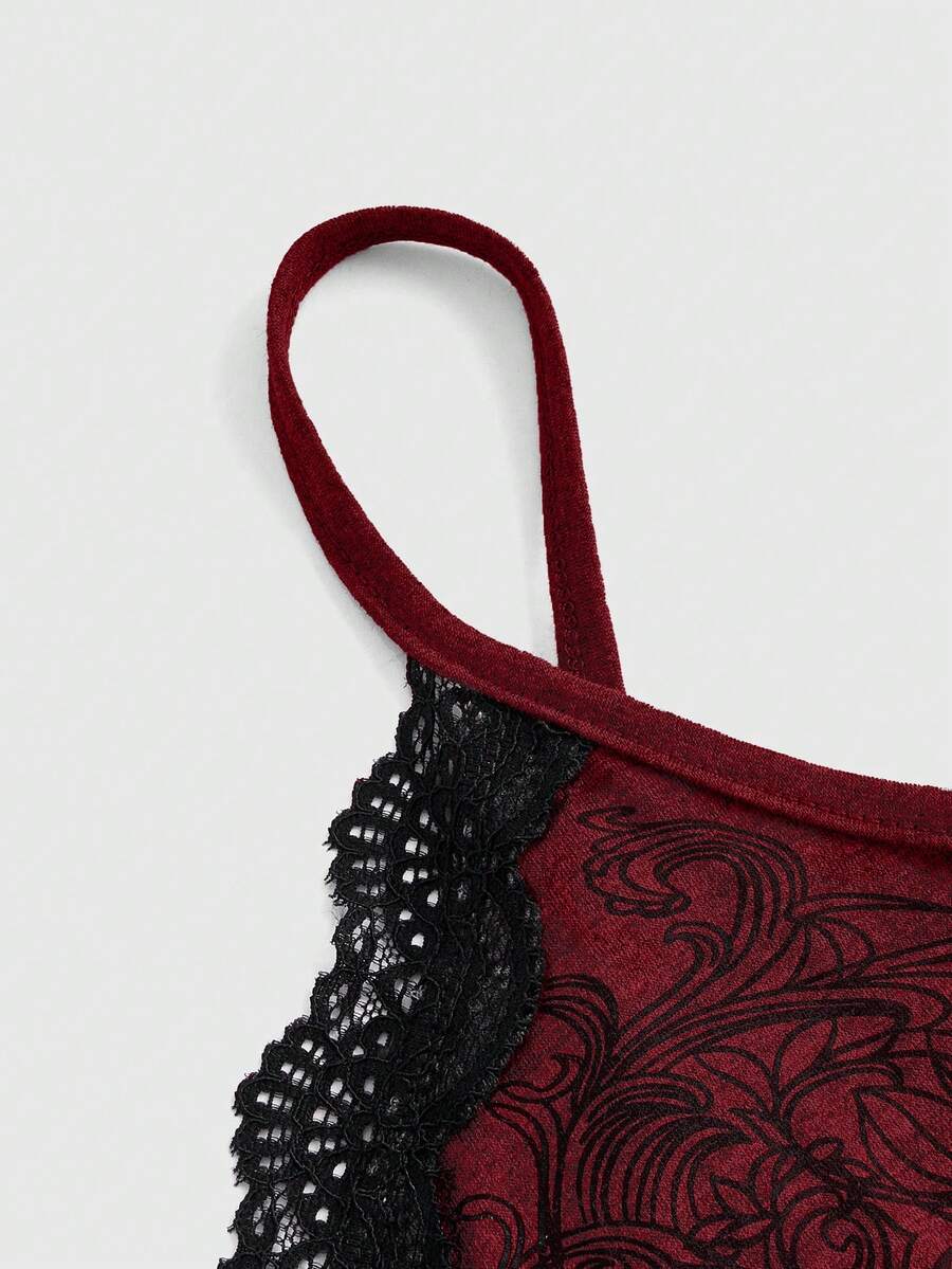 Pink floral print crop camisole top for women featuring contrast lace trim, spaghetti straps, and a slim fit.