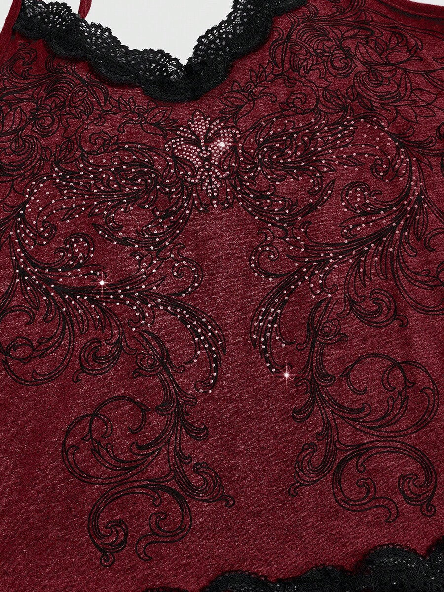Pink floral print crop camisole top for women featuring contrast lace trim, spaghetti straps, and a slim fit.