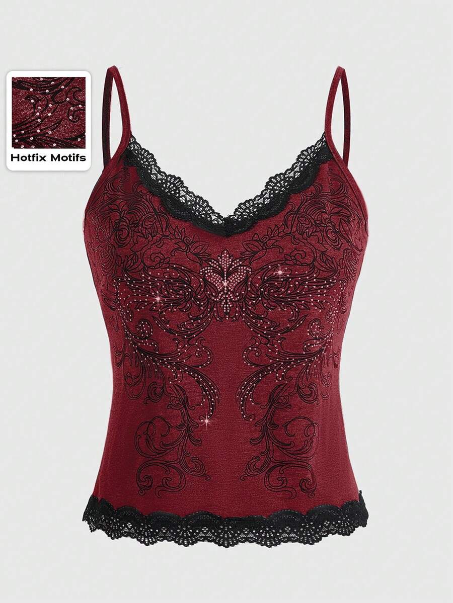 Pink floral print crop camisole top for women featuring contrast lace trim, spaghetti straps, and a slim fit.