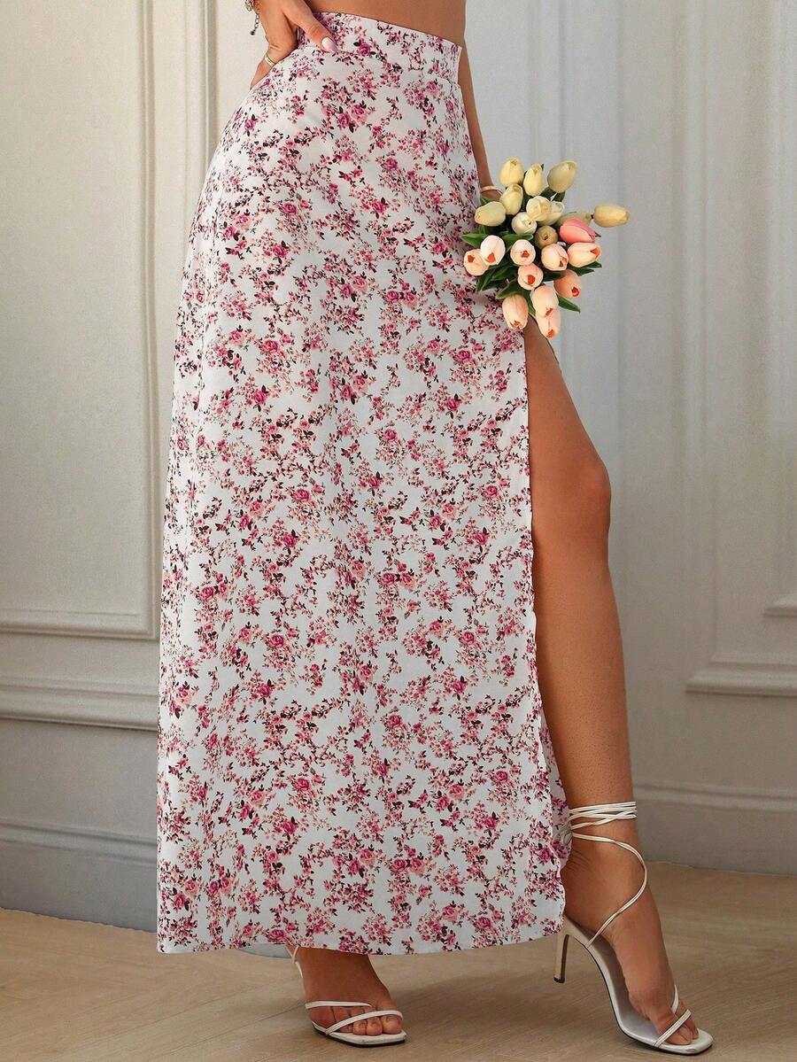 Women's black boho ditsy floral print maxi skirt featuring a high waist and a stylish split thigh slit detail.