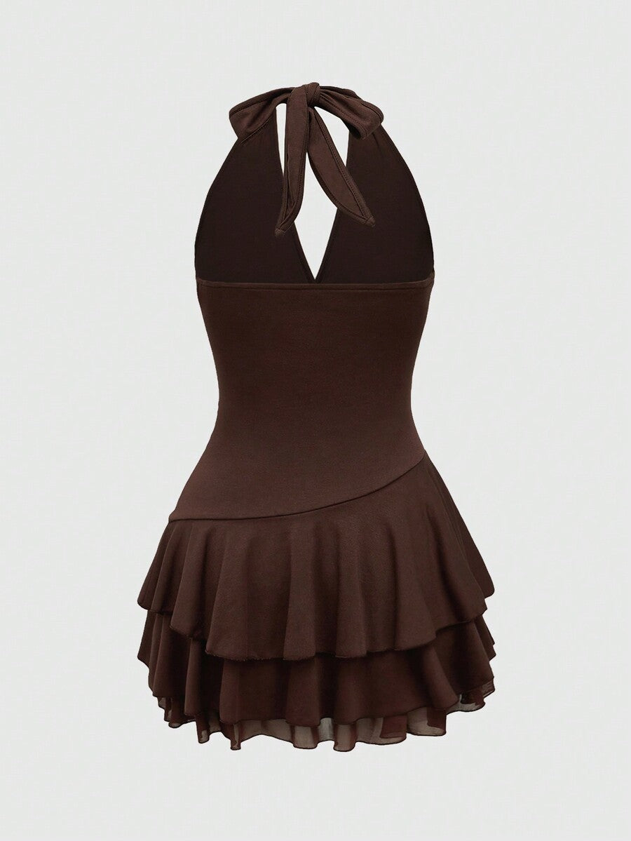 Women's sun totem embroidered sleeveless layered mini dress featuring a halter neck, backless tie back design, and slim fit high-waist A-line silhouette.