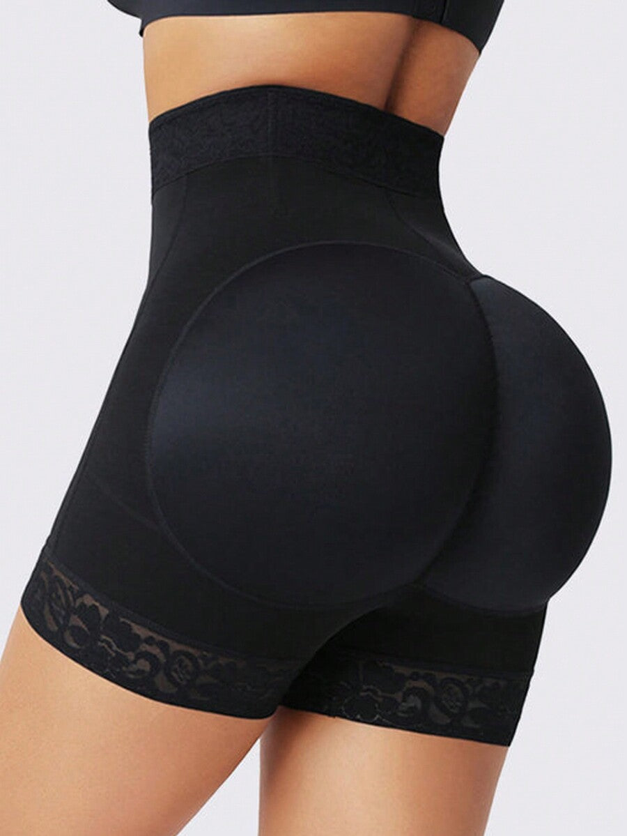 Black high waist butt lifting shapewear shorts made from mesh fabric with contrast lace trim and a front zipper for tummy and thigh shaping.