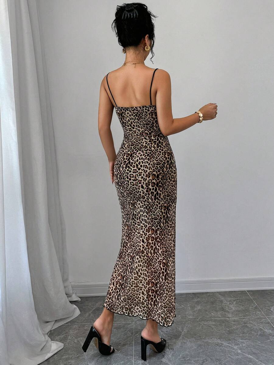 Women wearing a brown leopard print midi cami dress with spaghetti straps, backless detail, and a side split thigh.
