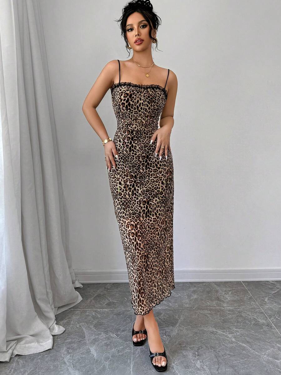 Women wearing a brown leopard print midi cami dress with spaghetti straps, backless detail, and a side split thigh.