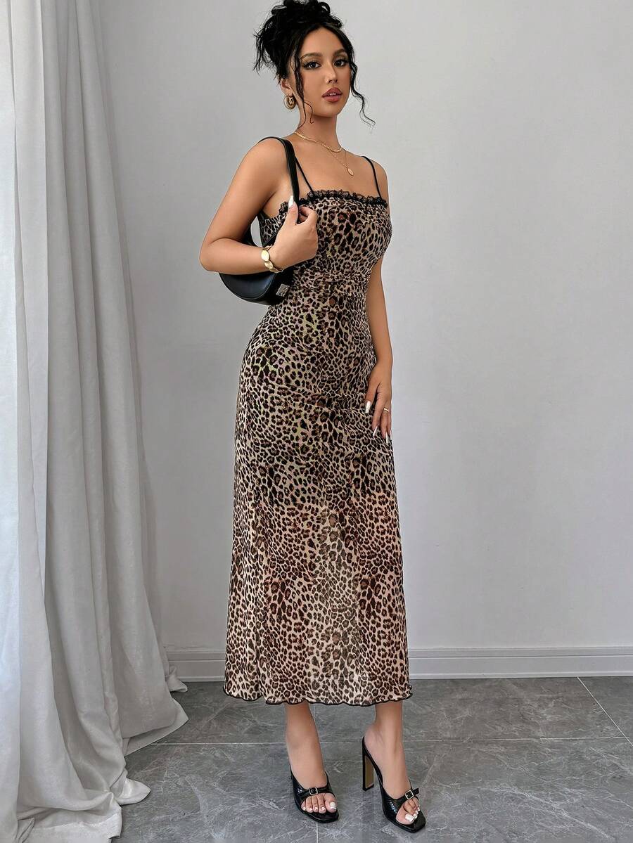 Women wearing a brown leopard print midi cami dress with spaghetti straps, backless detail, and a side split thigh.
