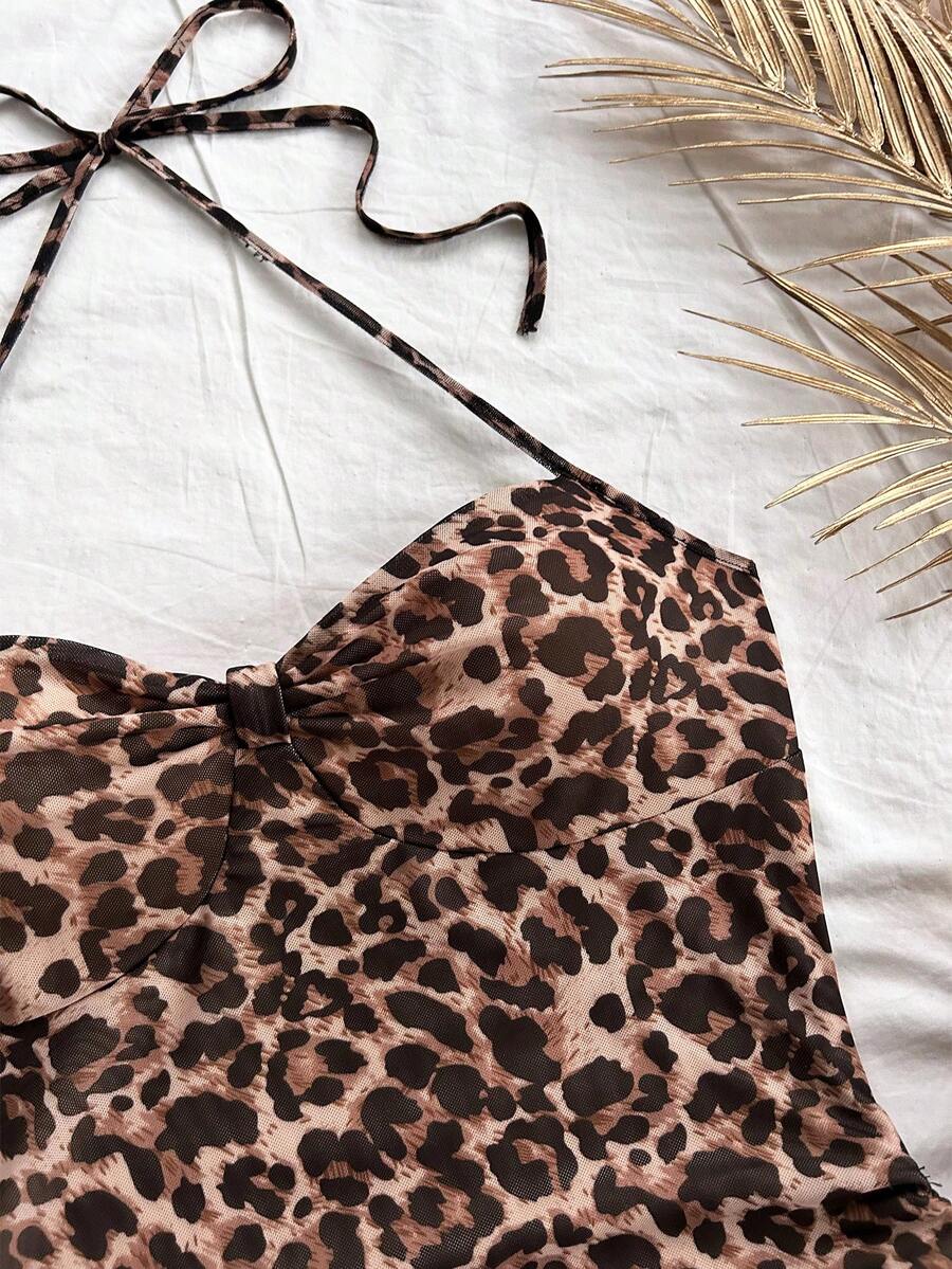 Multicolor leopard print sleeveless halter mini dress for women featuring a backless design, ruched drawstring hem, and slim fit.