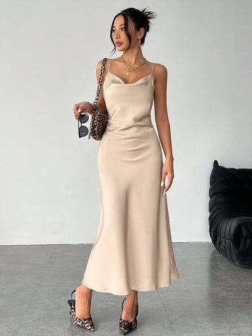 Women's long apricot satin cami dress featuring a draped swing collar, spaghetti straps, backless zipper back, and mermaid hem.
