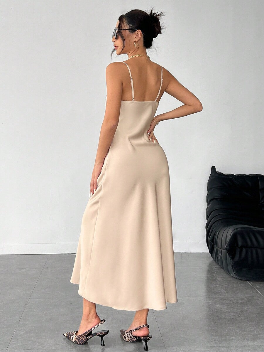 Women's long apricot satin cami dress featuring a draped swing collar, spaghetti straps, backless zipper back, and mermaid hem.