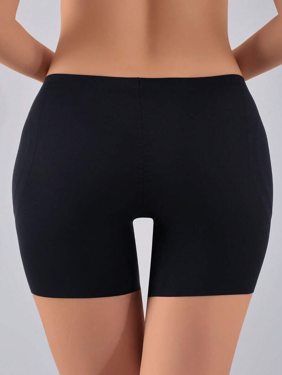 Women's apricot seamless padded shapewear panties featuring tummy control design and teardrop foam padding.