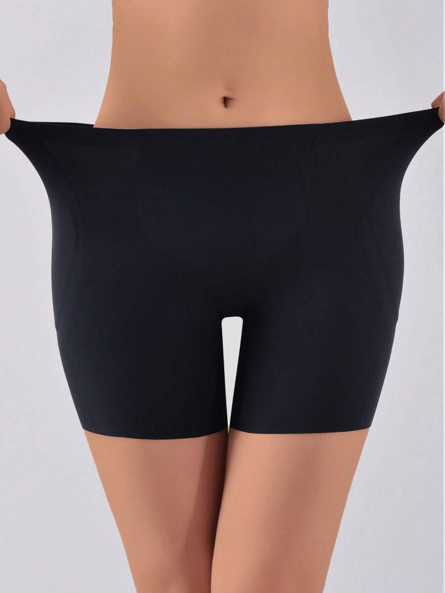 Women's apricot seamless padded shapewear panties featuring tummy control design and teardrop foam padding.