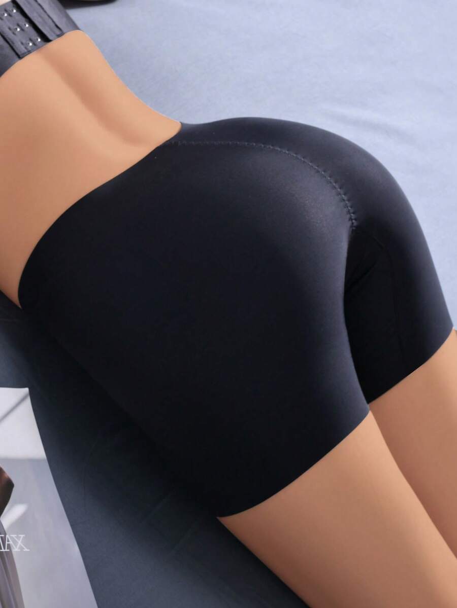 Women's apricot seamless padded shapewear panties featuring tummy control design and teardrop foam padding.