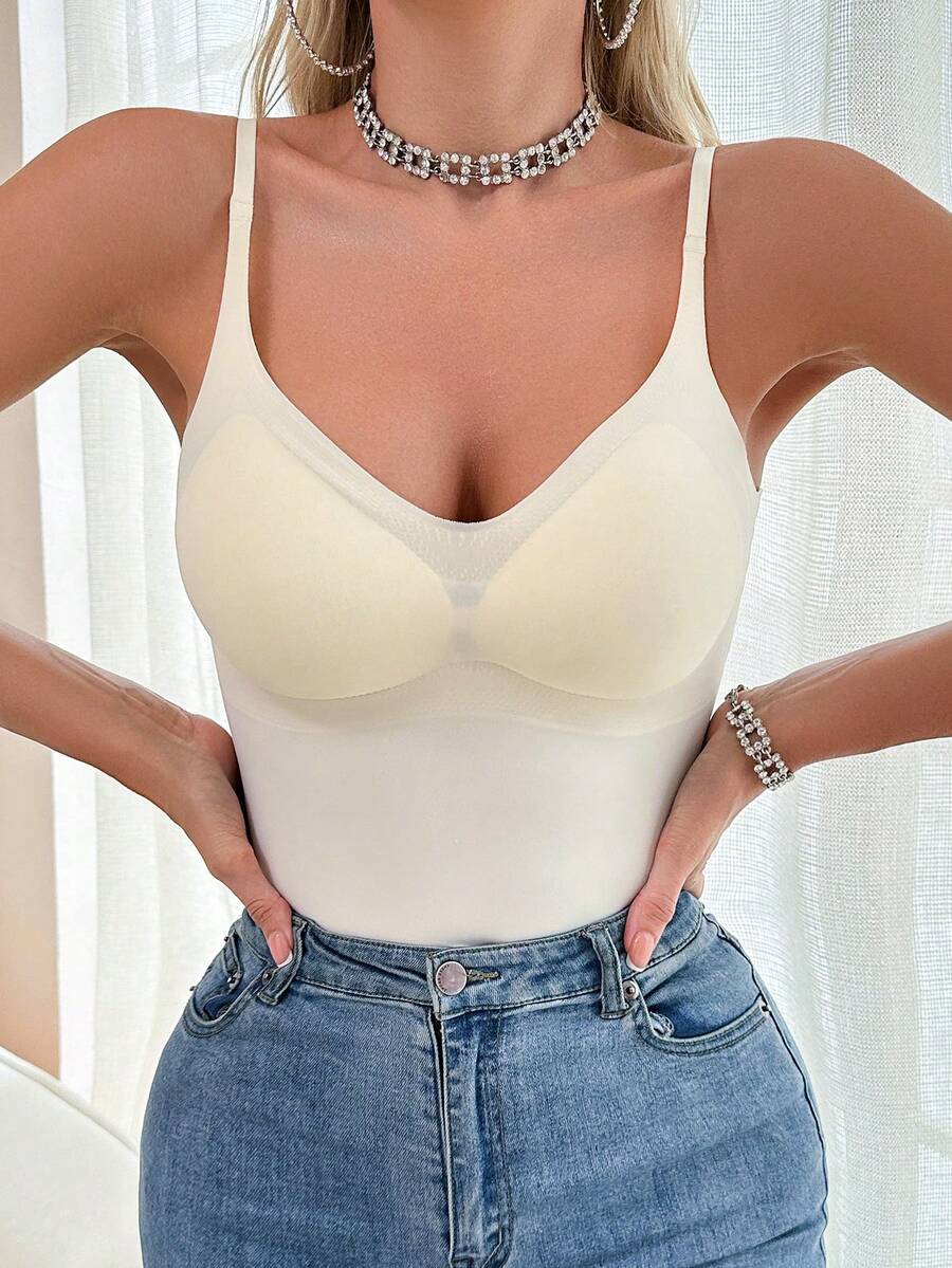 Beige minimalist wireless spaghetti strap camisole bra top for women with removable padding